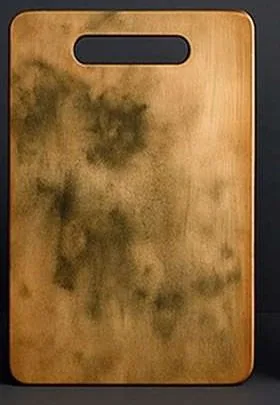Illustrative wooden cutting board with visible wear
